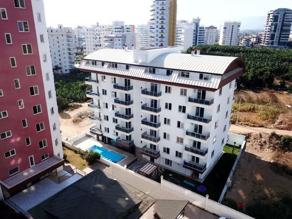 Меблированные апартаменты 1+1 в современном жилом комплексе в районе Махмутлар - Фото 11