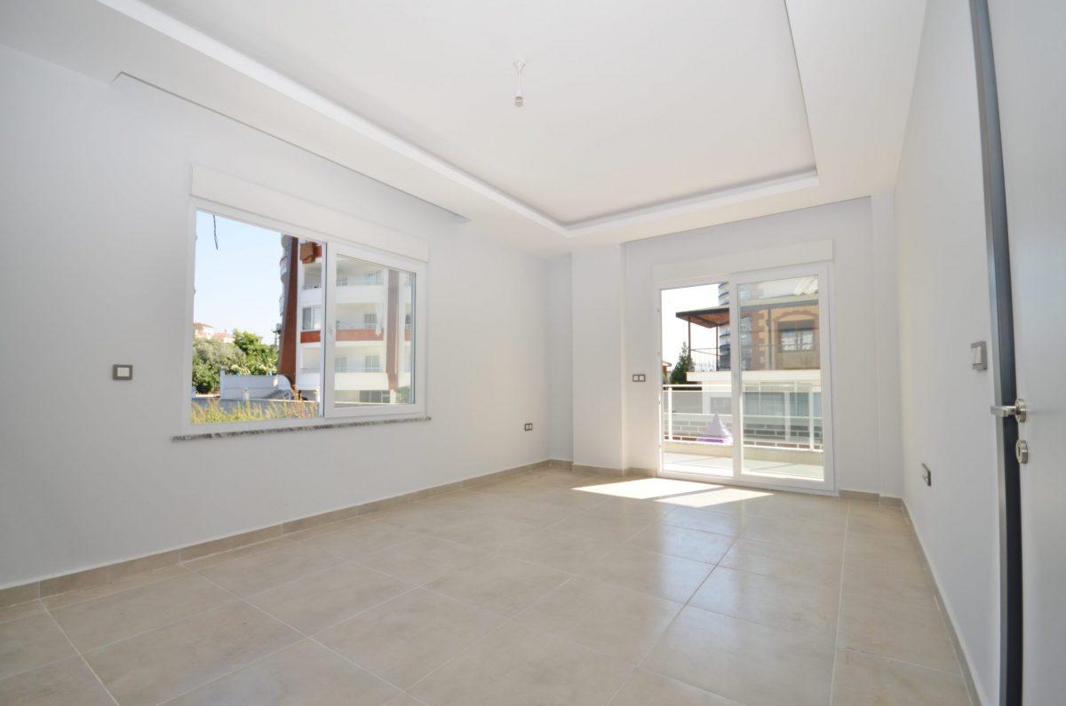 Двухкомнатная квартира с широким внешним балконом в районе Махмутлар - Фото 27