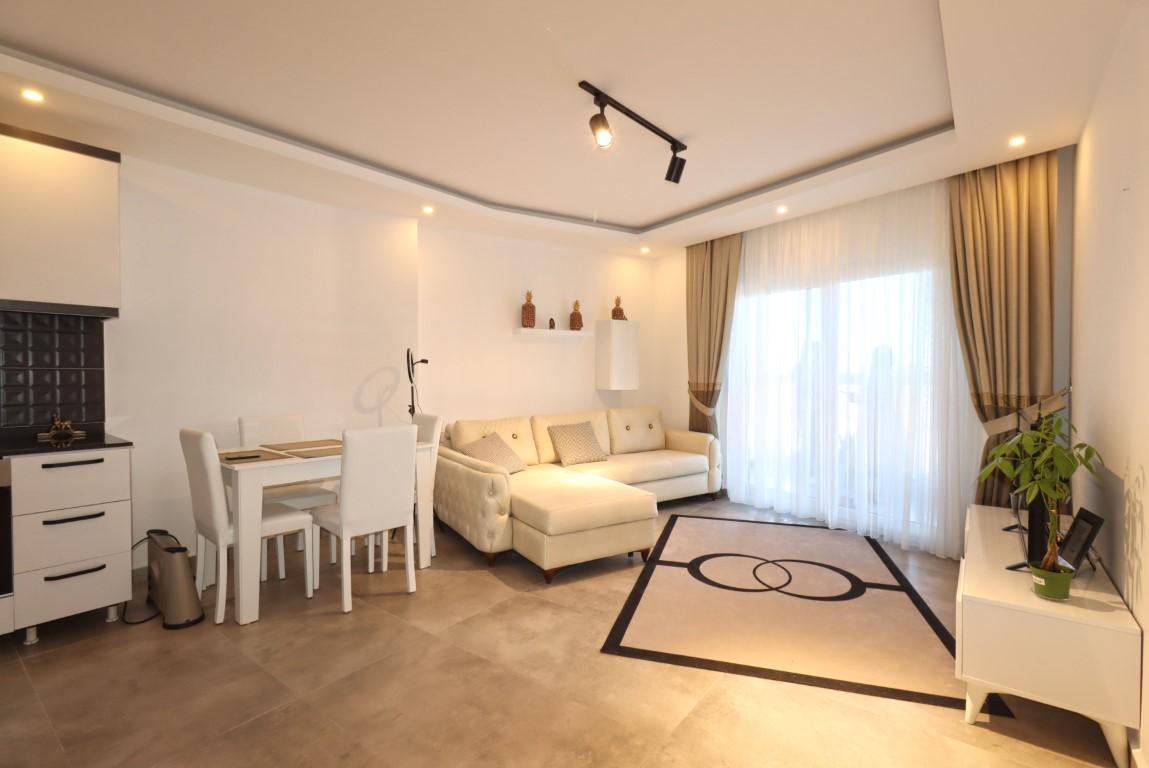 Двухкомнатная меблированная 61 м² квартира в районе Каргыджак