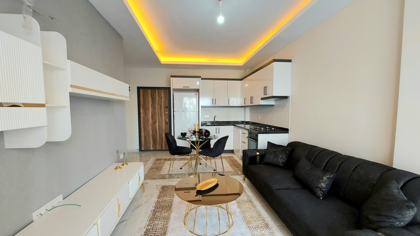 Светлая и просторная двухкомнатная квартира в районе Махмутлар