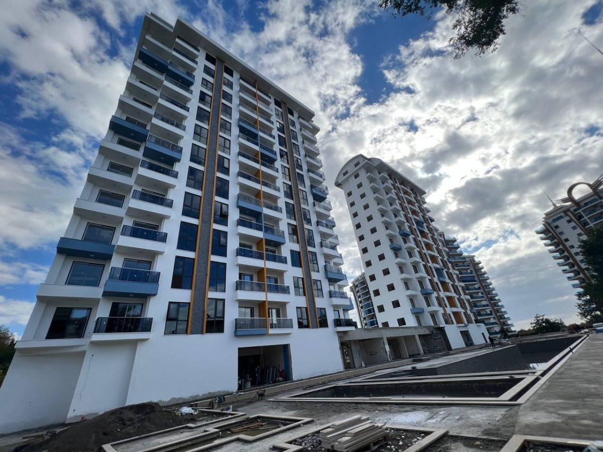 Апартаменты 1+1 с видом на море и горы в новом ЖК района Махмутлар