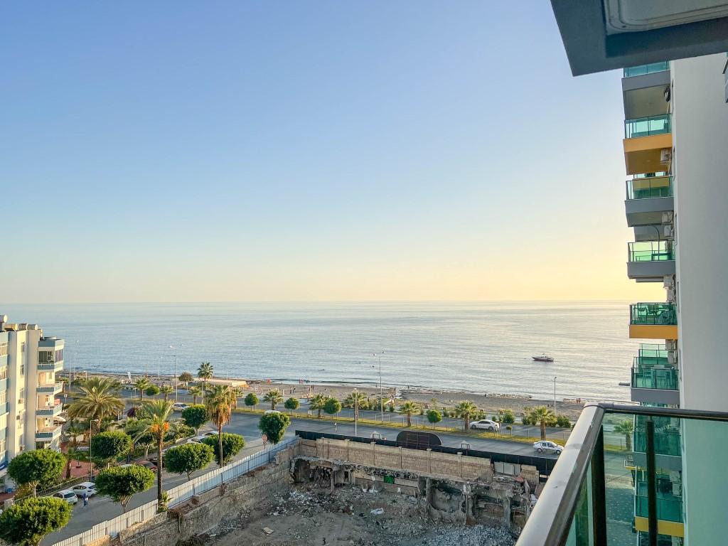 Апартаменты 2+1 и площадью 90 м2 с видом на море и на расстоянии 50 метров от пляжа в Махмутларе - Фото 20