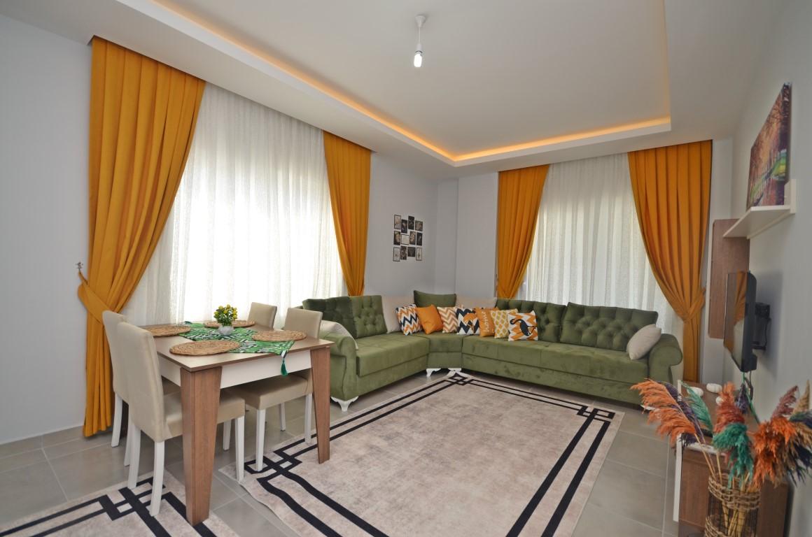 Меблированная квартира планировкой 1+1, площадью 55 м2, в Махмутларе, Турция