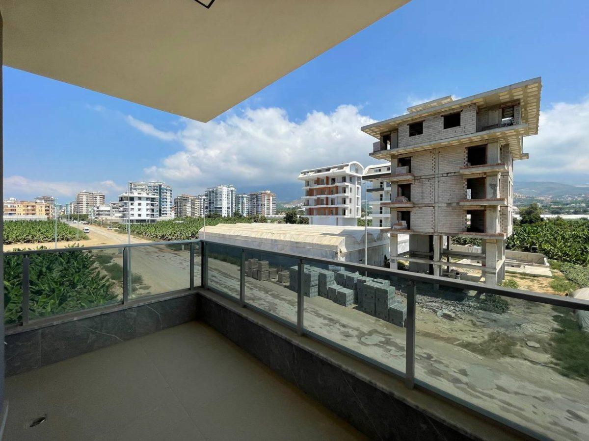 Меблированные апартаменты планировкой 2+1 рядом с морем в районе Каргыджак - Фото 33