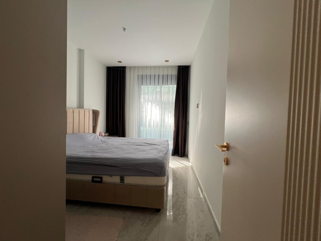 Двухкомнатная квартира 50 м² рядом с морем в центре Алании - Фото 36