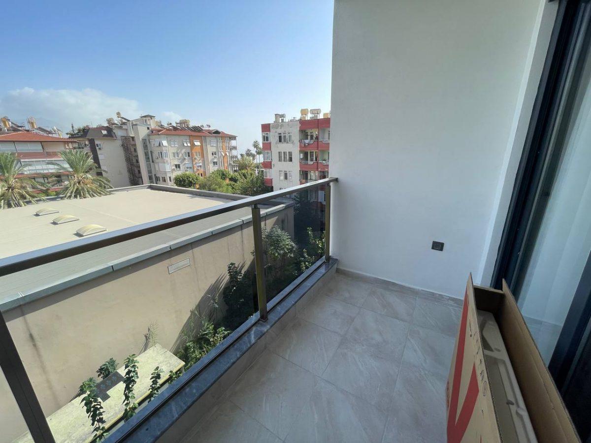Двухкомнатная квартира с просторным балконом в центре Алании - Фото 15