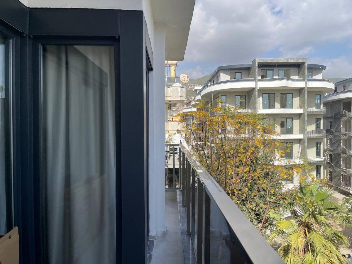 Двухкомнатная квартира с просторным балконом в центре Алании - Фото 17