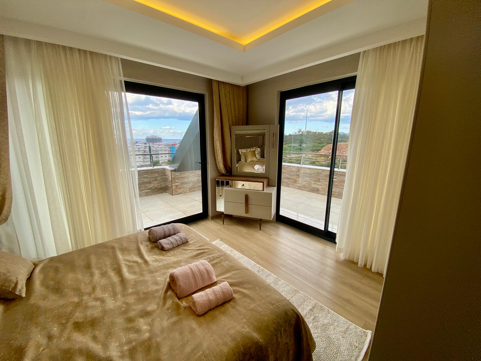 Просторный меблированный дуплекс 4+1 с видом на море в районе Кестель, Алания. - Фото 14