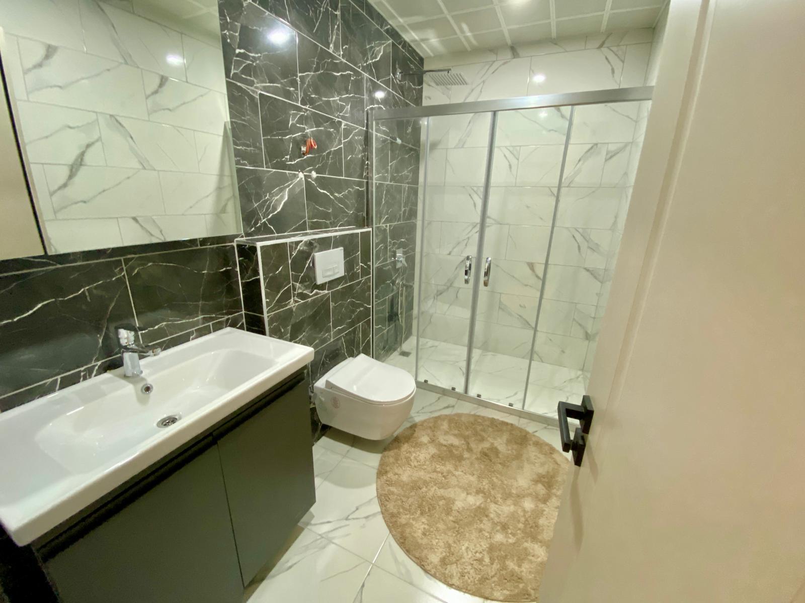 Просторный меблированный дуплекс 4+1 с видом на море в районе Кестель, Алания. - Фото 11