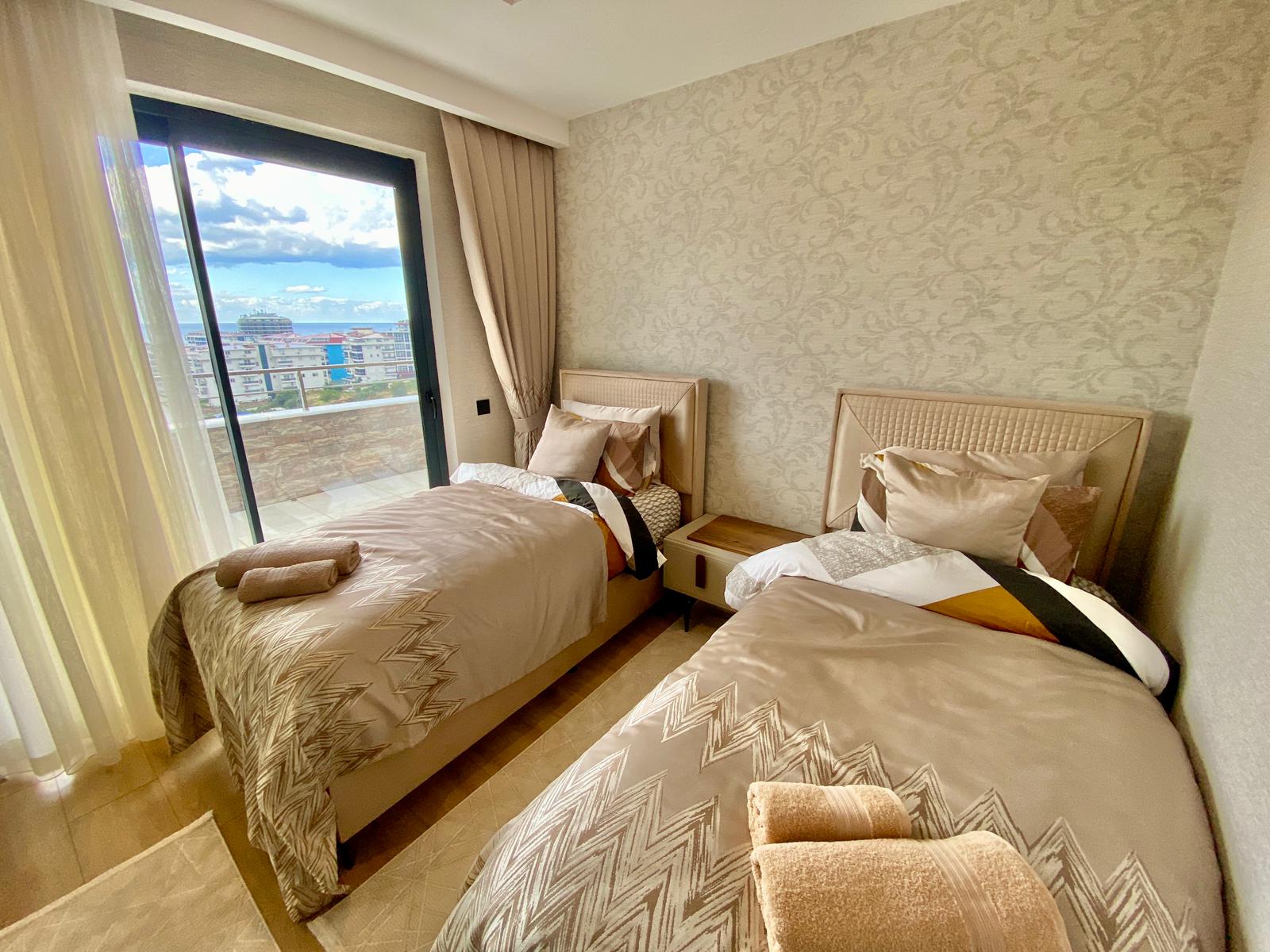 Просторный меблированный дуплекс 4+1 с видом на море в районе Кестель, Алания. - Фото 18