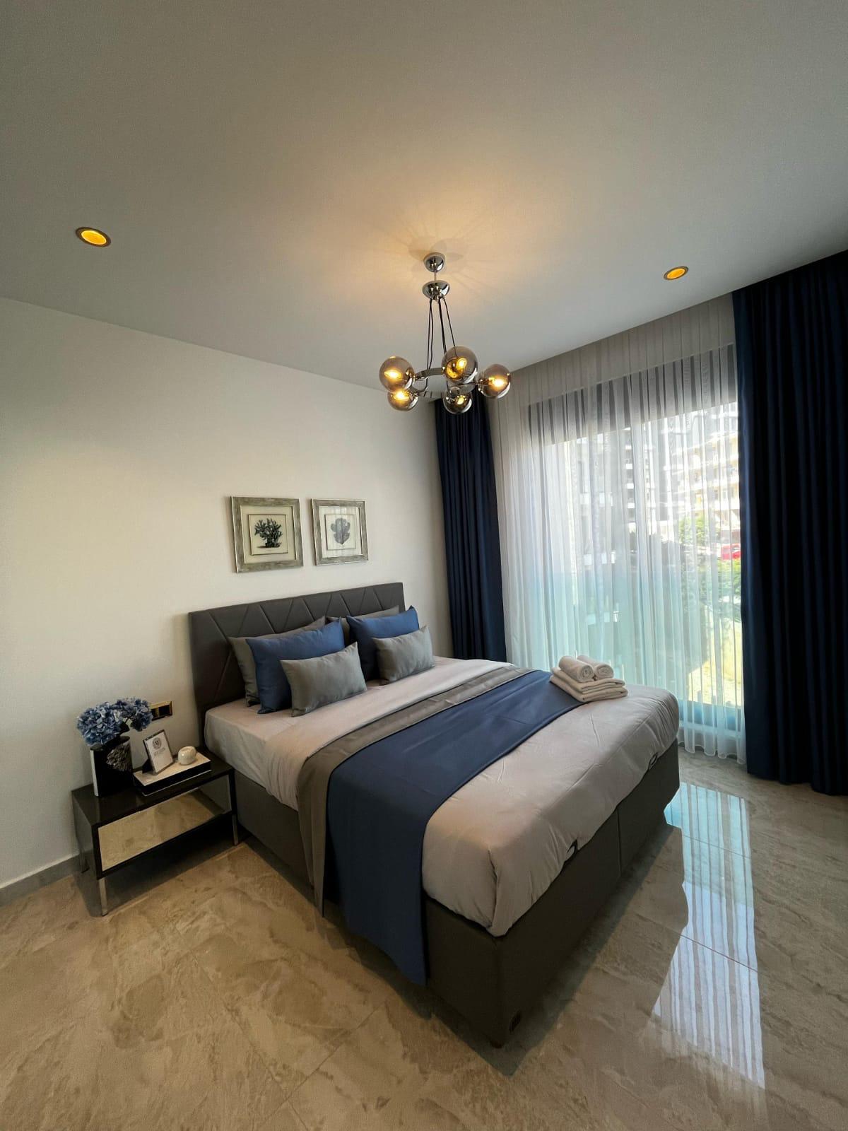 Апартаменты планировкой 1+1 рядом с морем в районе Тосмур. - Фото 46