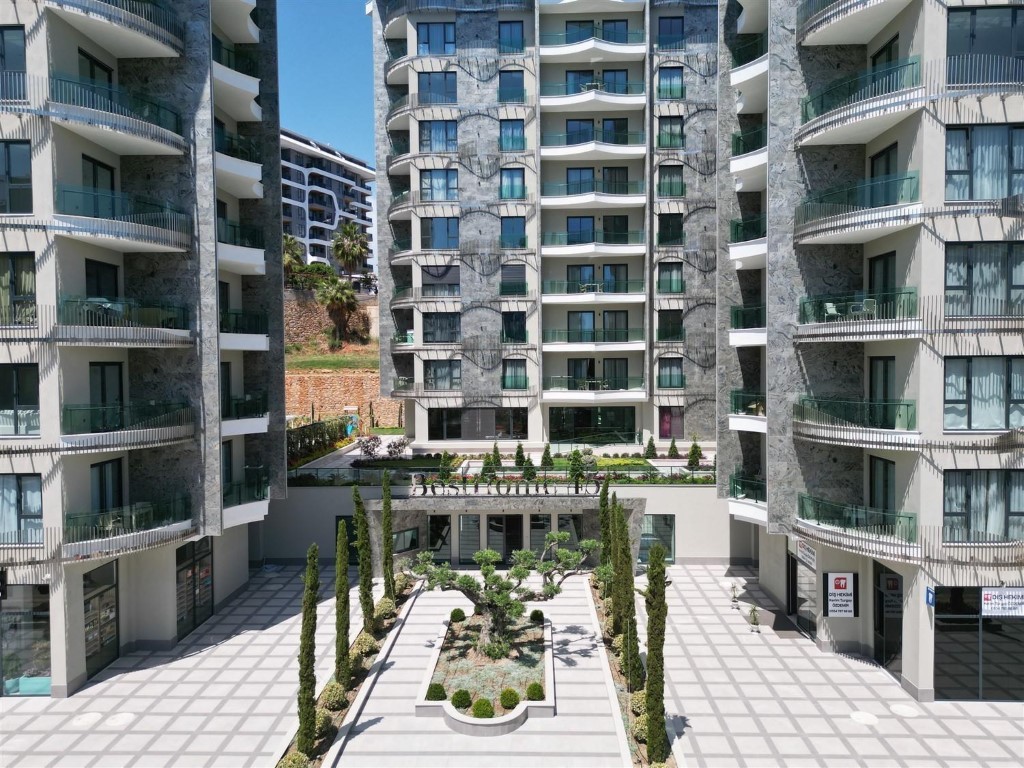 Апартаменты планировкой 1+1 рядом с морем в районе Тосмур. - Фото 11