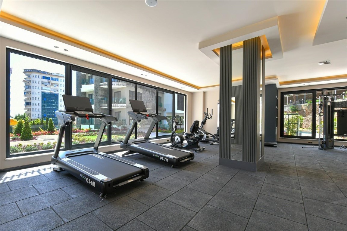 Апартаменты планировкой 1+1 рядом с морем в районе Тосмур. - Фото 36