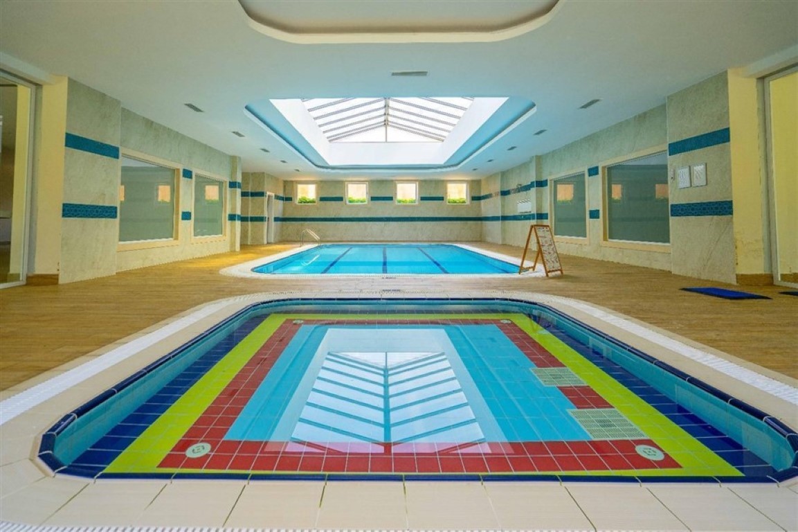 Просторные апартаменты 2+1 расположены в современном жилом комплексе района Оба. - Фото 8