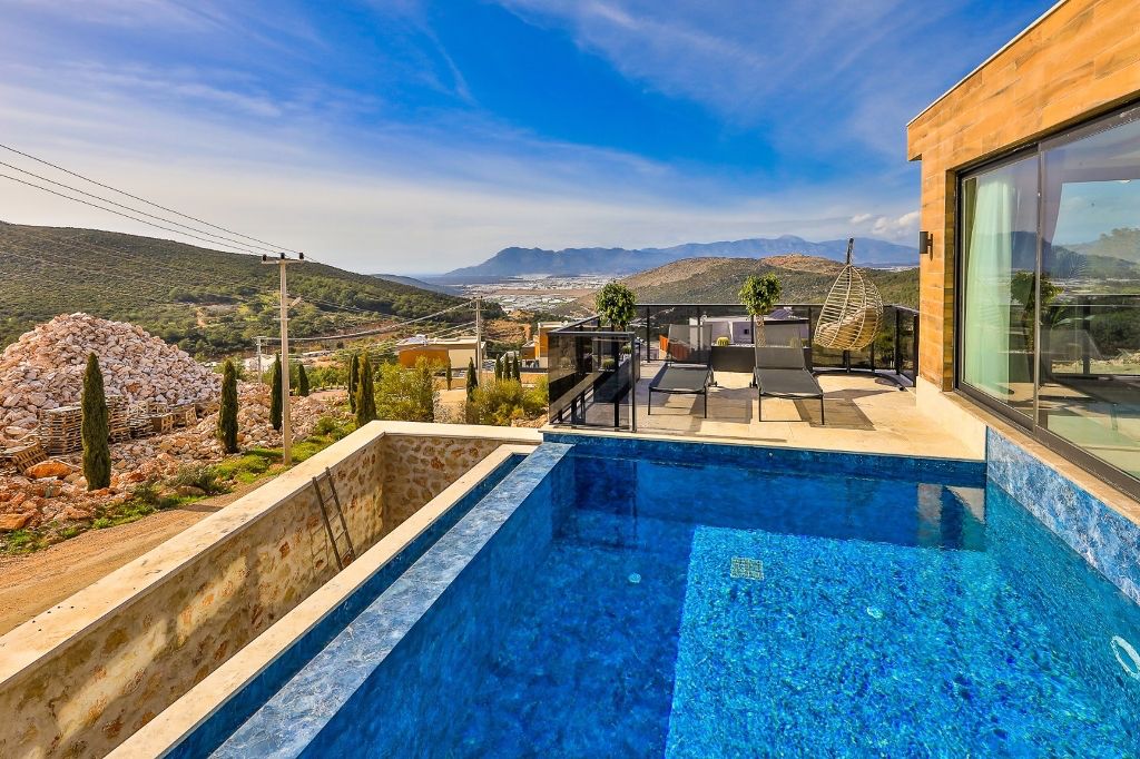 Шикарная вилла с видом на море и горы в Фетхие. - Фото 10