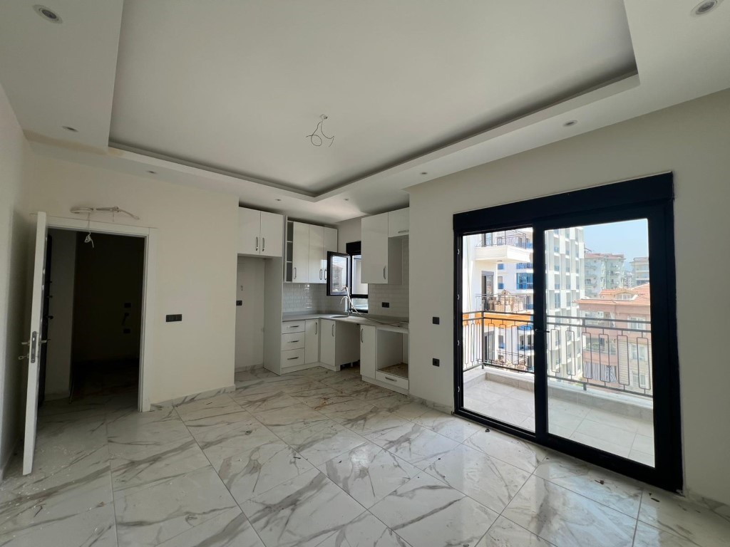 Двухкомнатная квартира в новым жилом комплекс в центре Аланьи. - Фото 11