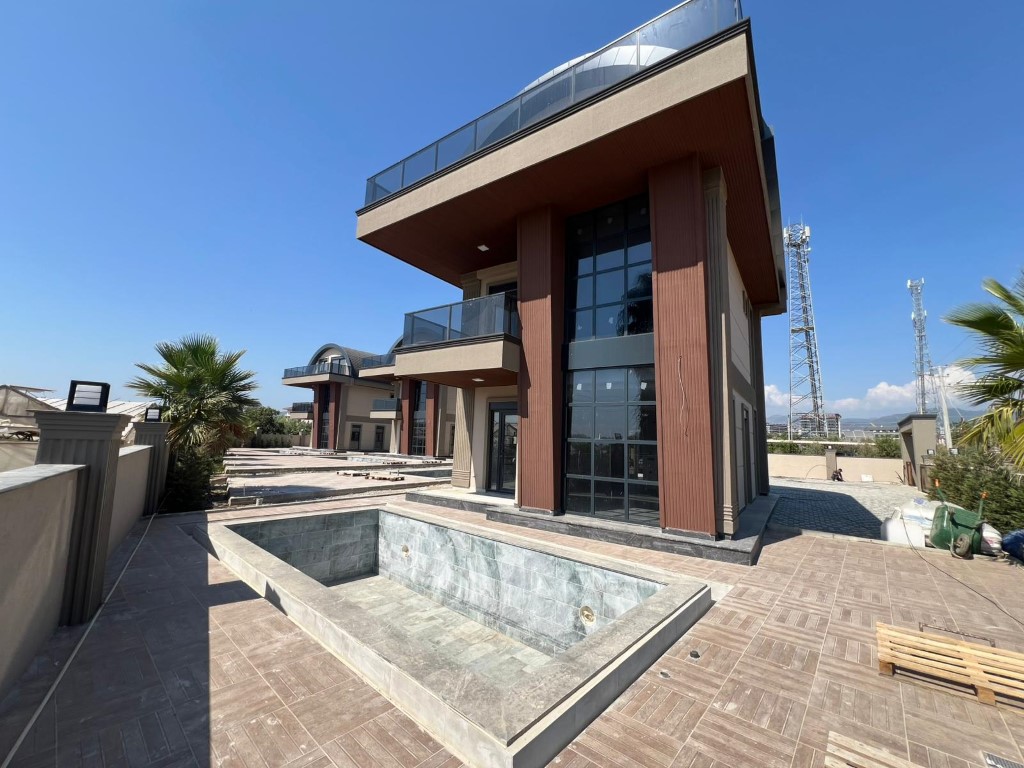 Новая современная вилла с личным бассейном в районе Паяллар Аланья. 