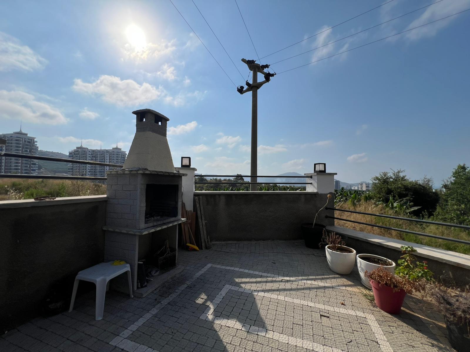 Уютная двухкомнатная квартира в живописном районе Махмутлар Алания. - Фото 11