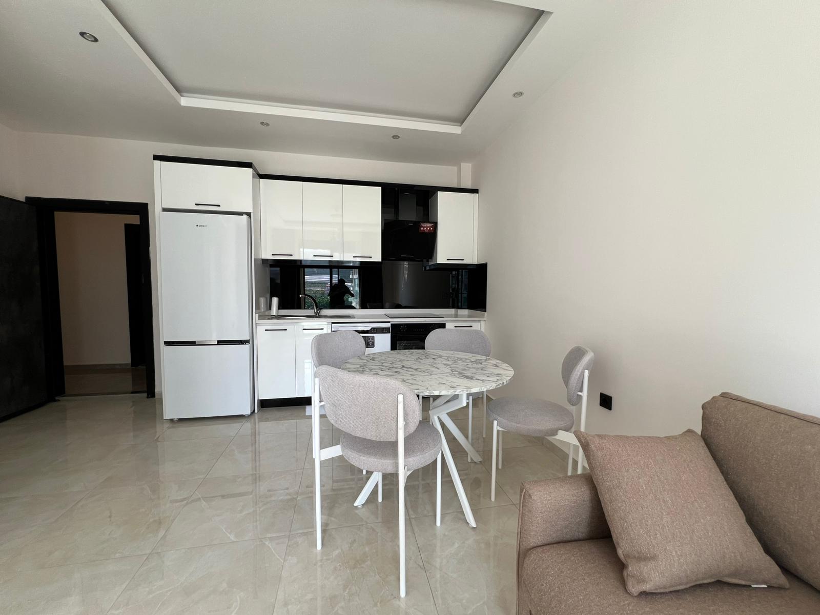 Уютная двухкомнатная квартира в живописном районе Махмутлар Алания. - Фото 18