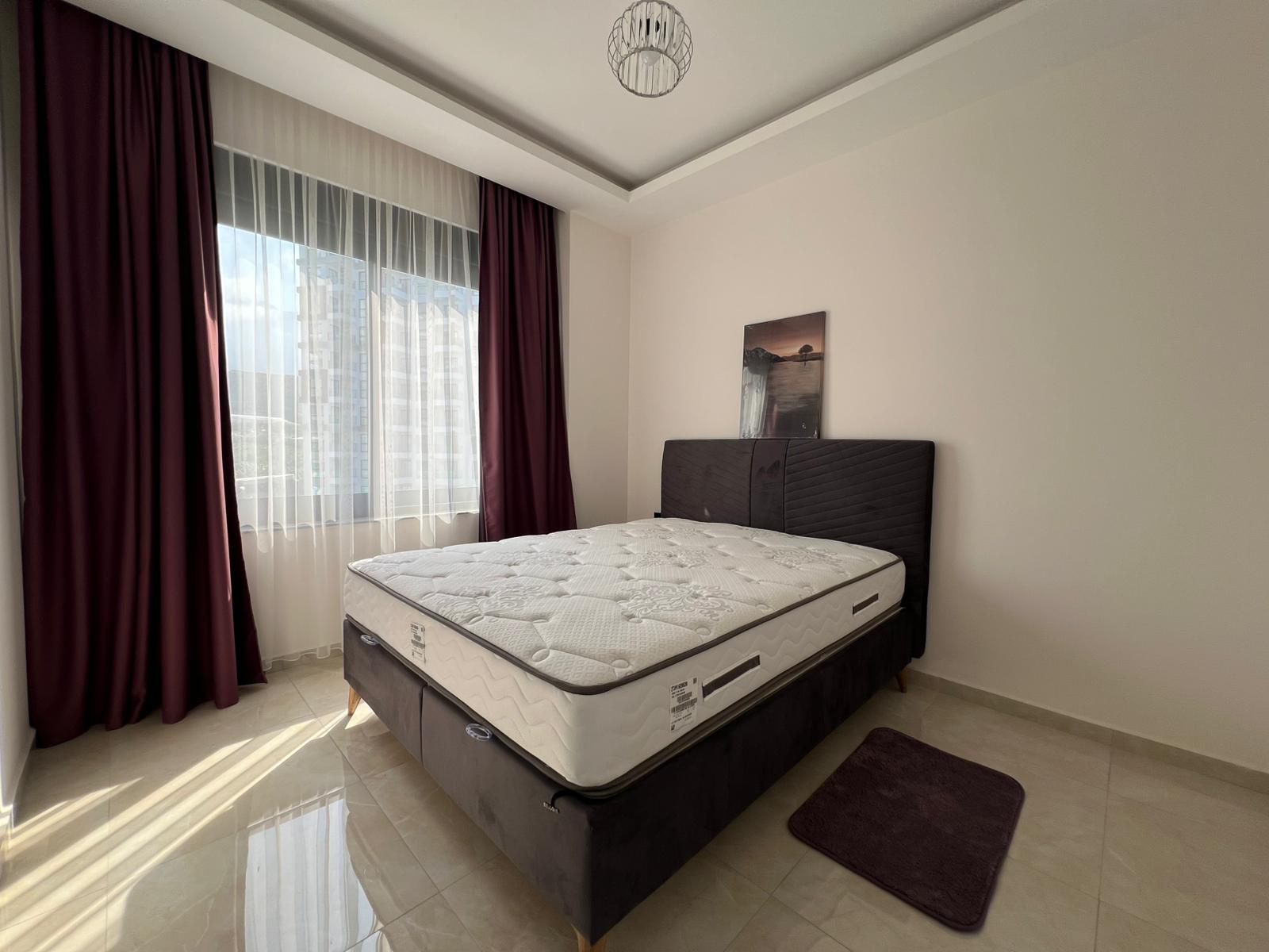 Уютная двухкомнатная квартира в живописном районе Махмутлар Алания. - Фото 24