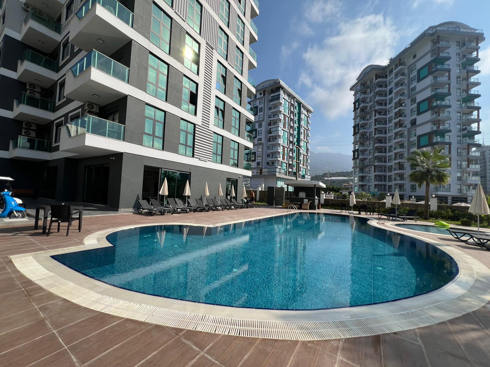 Уютная двухкомнатная квартира в живописном районе Махмутлар Алания.