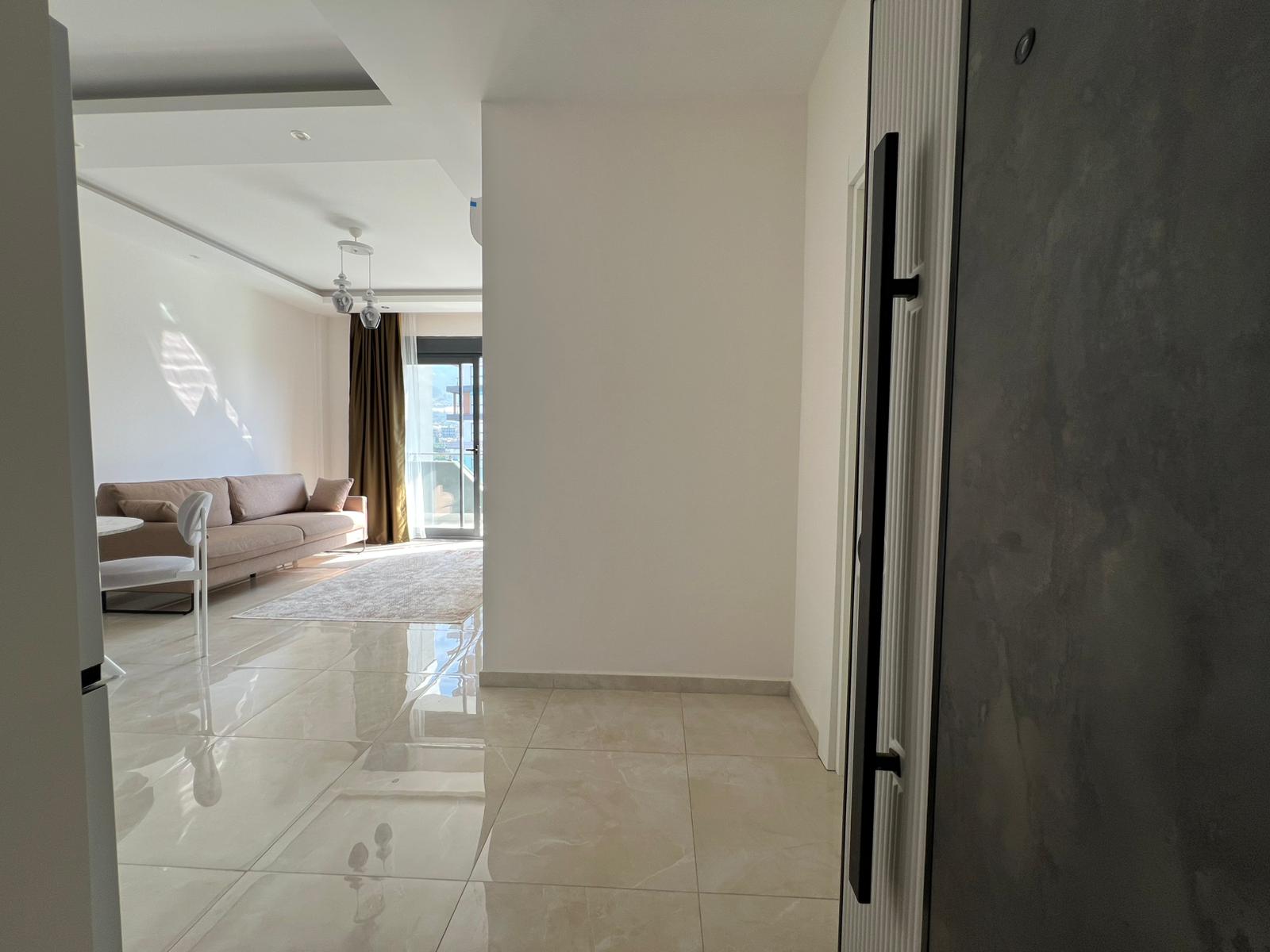 Уютная двухкомнатная квартира в живописном районе Махмутлар Алания. - Фото 17