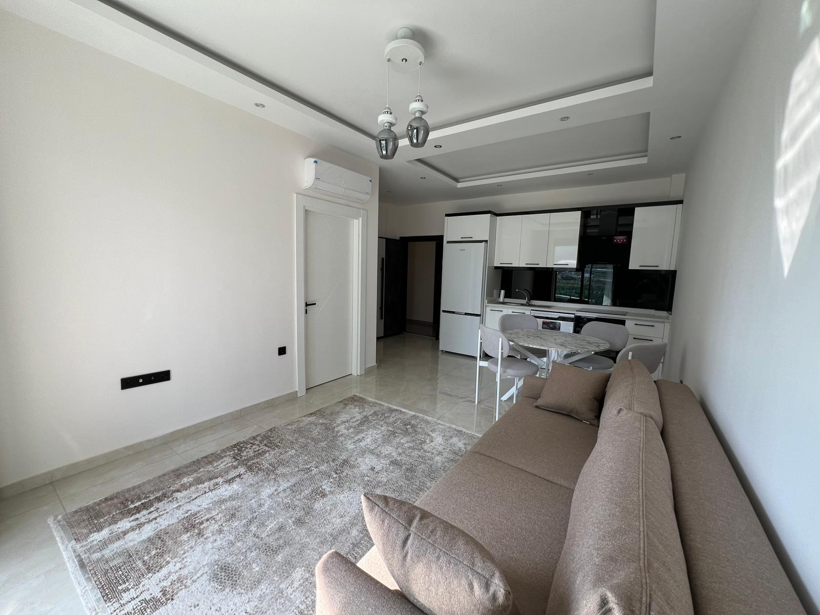 Уютная двухкомнатная квартира в живописном районе Махмутлар Алания. - Фото 20