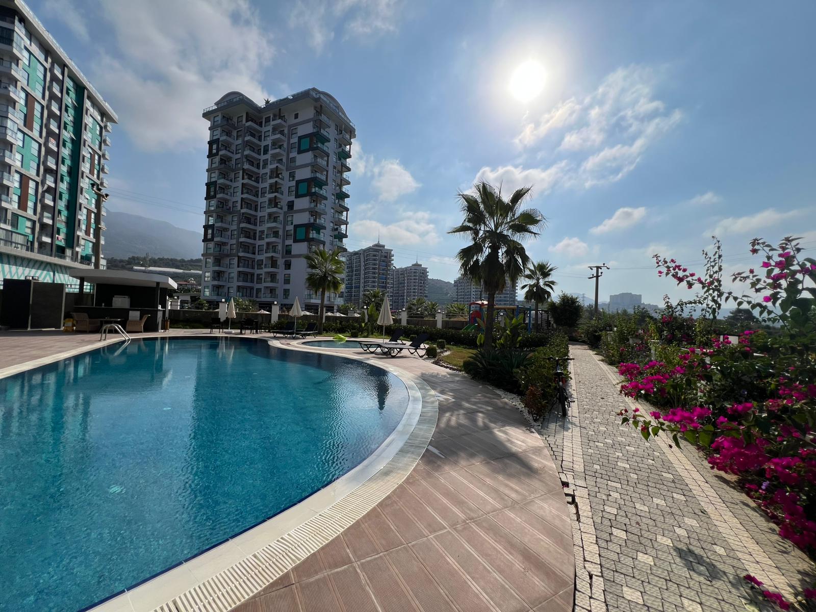 Уютная двухкомнатная квартира в живописном районе Махмутлар Алания. - Фото 2