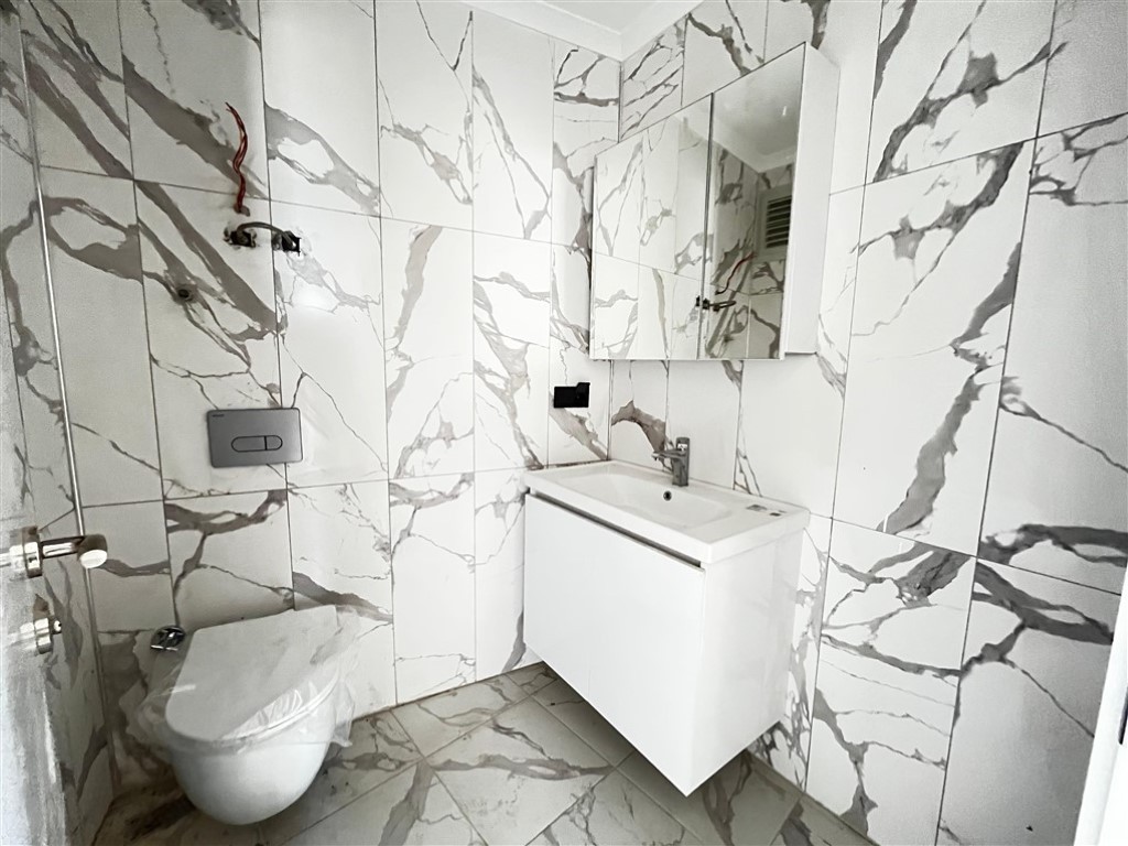 Квартира планировкой 2+1 с видом на море и город в районе Махмутлар Аланья.  - Фото 17