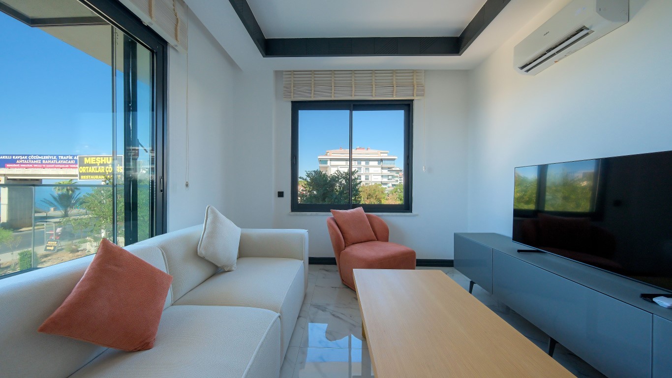 Мебелированная квартира планировкой 1+1 на первой береговой линии район Кестель Аланья.  - Фото 3