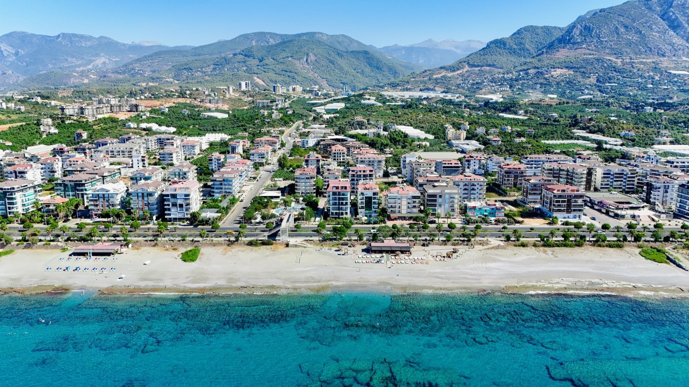 Мебелированная квартира планировкой 1+1 на первой береговой линии район Кестель Аланья.  - Фото 22