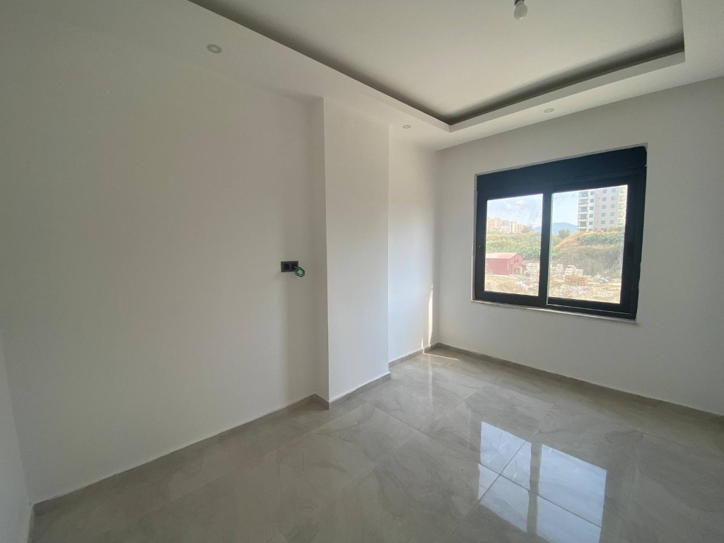 Квартира в новом комплексе планировкой 1+1 55м район Махмутлар Аланья. - Фото 13