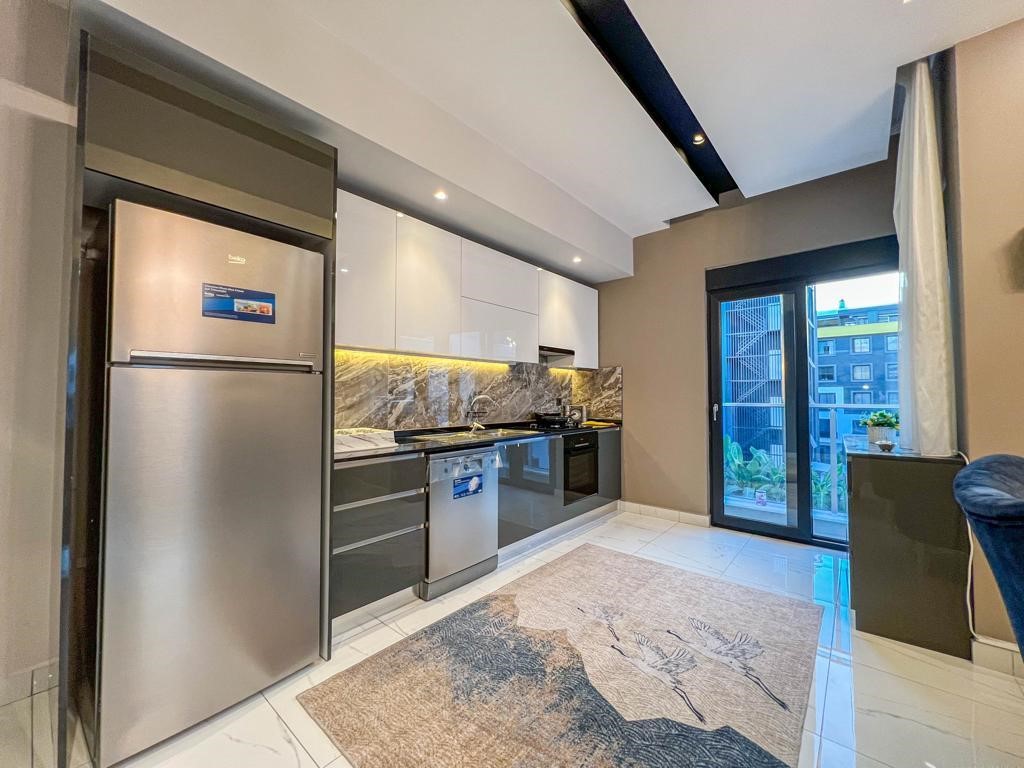 Просторная мебелированная квартира в современном комплексе район Оба Аланья. - Фото 23